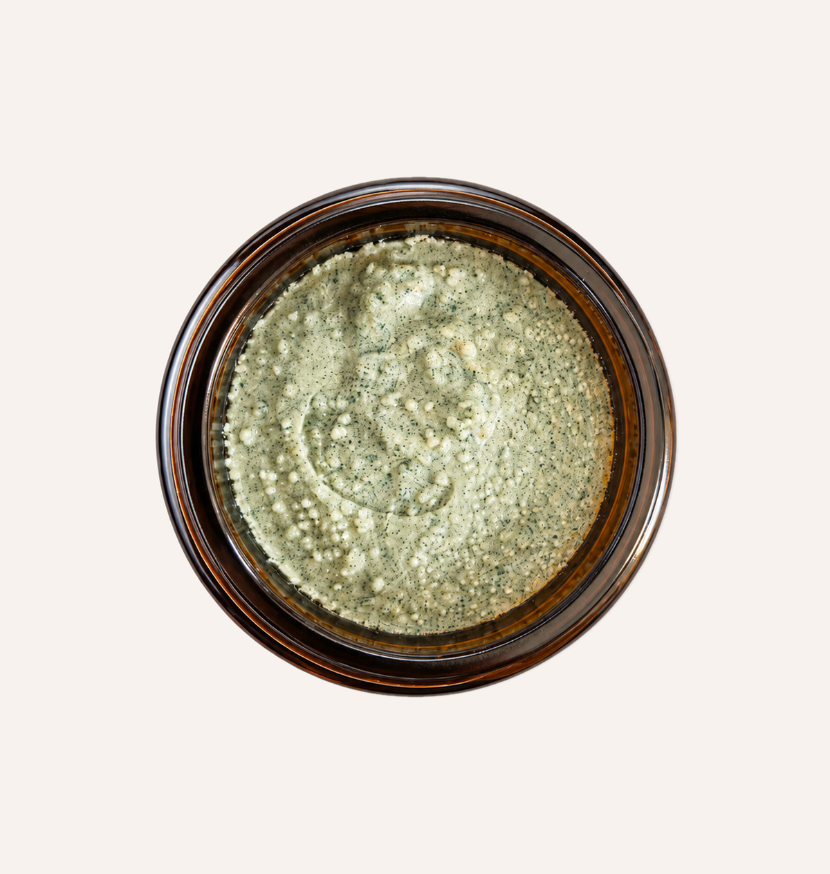 Top view of open Papaya Cosmetics Face Mask 60 ml jar showing the green clay mask texture